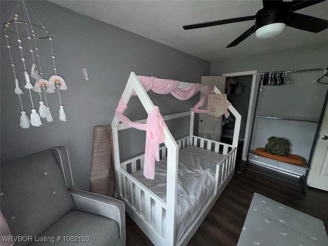 412 7th St, Barling, AR 72923 - bedroom with wood finished floors and a ceiling fan