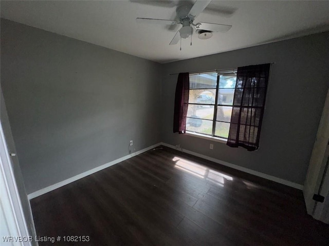 412 7th St, Barling, AR 72923 - unfurnished room with dark wood-style flooring and ceiling fan