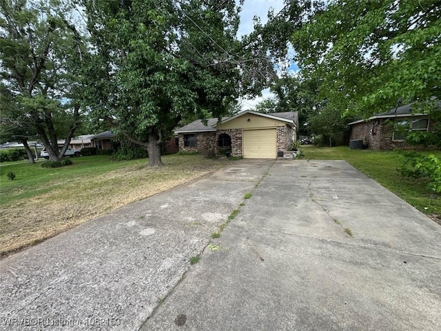 412 7th St, Barling, AR 72923 - view of front of house with a garage, a front lawn, and driveway