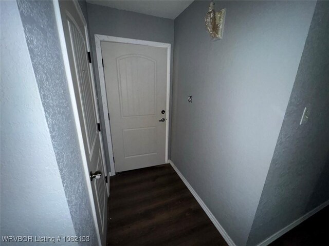 412 7th St, Barling, AR 72923 - hall with dark wood-style flooring and baseboards