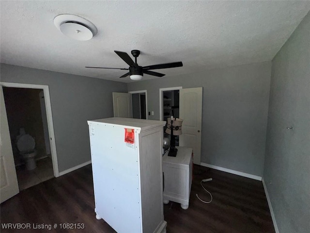 412 7th St, Barling, AR 72923 - office area with a ceiling fan, dark wood-style floors, and a textured ceiling
