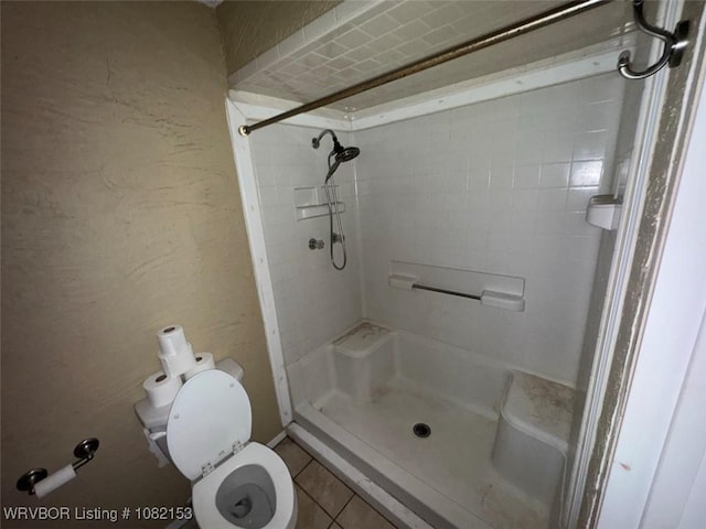 412 7th St, Barling, AR 72923 - bathroom featuring a stall shower and tile patterned floors
