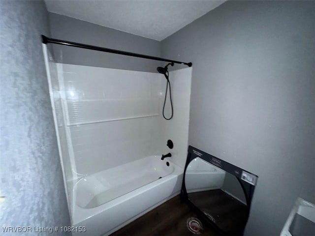 412 7th St, Barling, AR 72923 - bathroom with tub / shower combination and wood finished floors