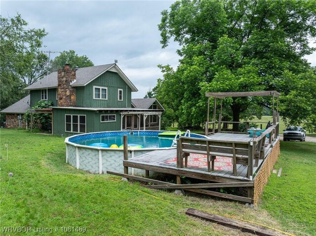 2650 Spielerville Rd, Paris, AR 72855 - outdoor pool featuring a wooden deck and a yard