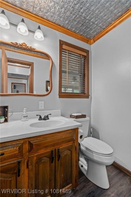 2650 Spielerville Rd, Paris, AR 72855 - half bath featuring crown molding, an ornate ceiling, vanity, toilet, and wood finished floors