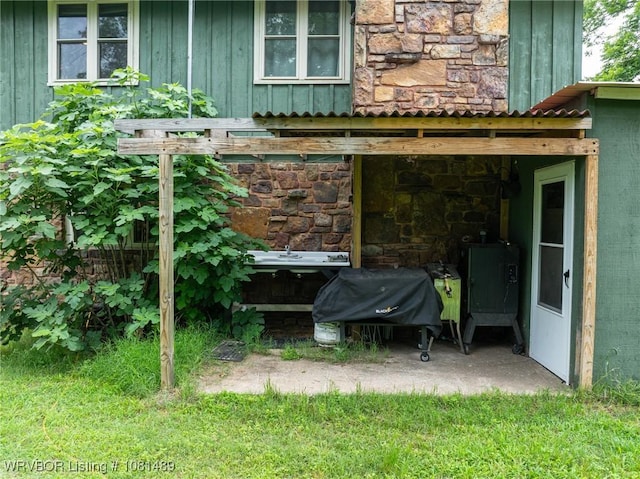 2650 Spielerville Rd, Paris, AR 72855 - exterior view of stone siding and board and batten siding