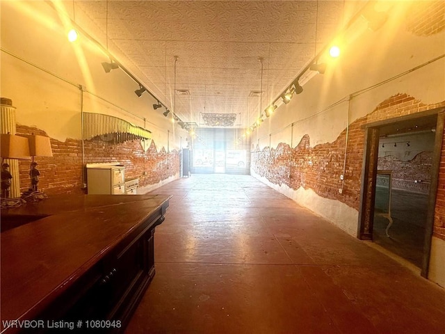 108 S Thornton St, Vian, OK 74962 - hallway featuring brick wall