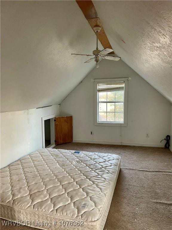 bonus room featuring a textured ceiling, light colored carpet, ceiling fan, and lofted ceiling