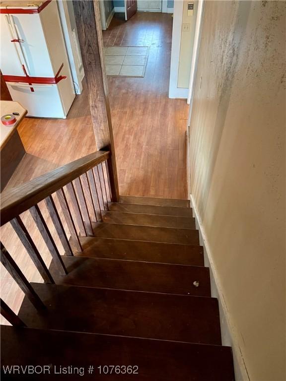 stairway with wood-type flooring