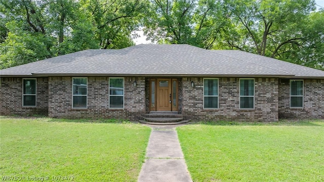 ranch-style home with a front lawn