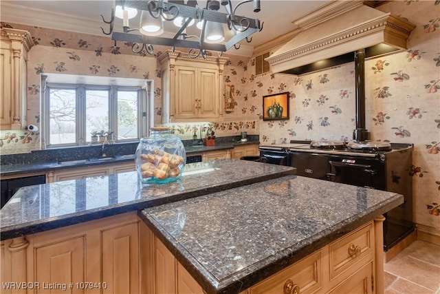 kitchen with wallpapered walls, ornamental molding, premium range hood, and a kitchen island