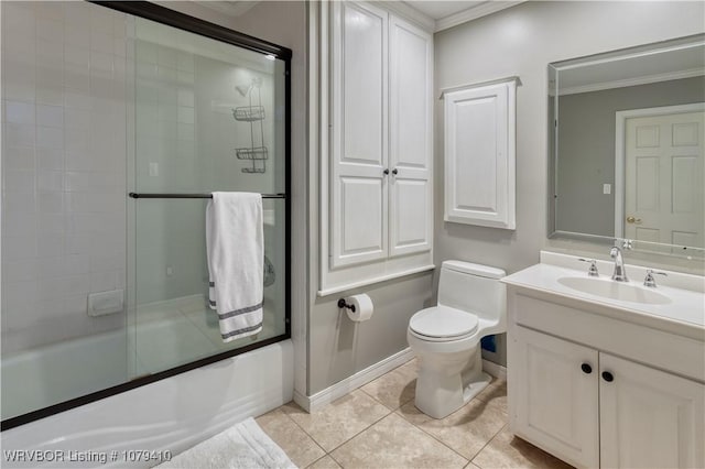 full bathroom with toilet, ornamental molding, tile patterned floors, combined bath / shower with glass door, and vanity