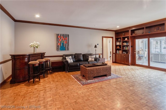 living area with recessed lighting, built in shelves, baseboards, and ornamental molding