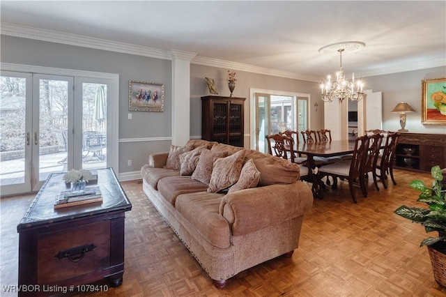 living area featuring french doors, baseboards, a chandelier, and crown molding