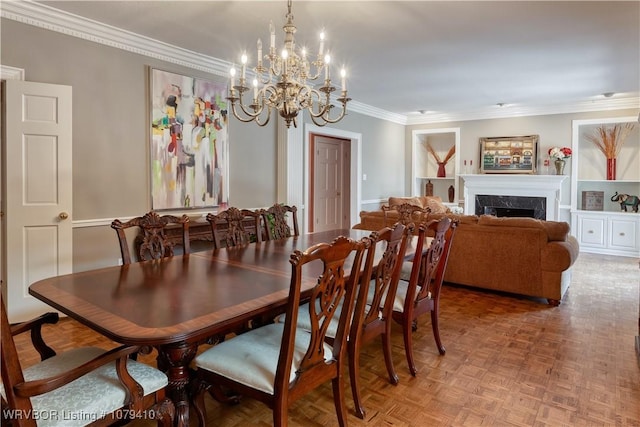 dining area featuring a high end fireplace and crown molding