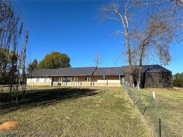 ranch-style house featuring a front lawn