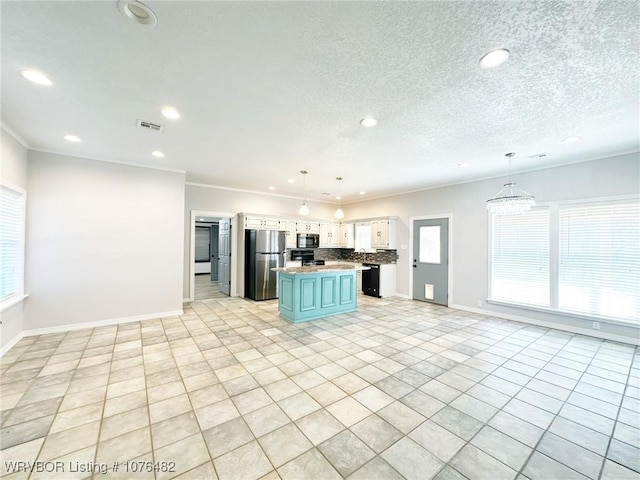 kitchen featuring white cabinetry, a kitchen island, black appliances, and decorative light fixtures