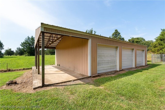 garage featuring a lawn