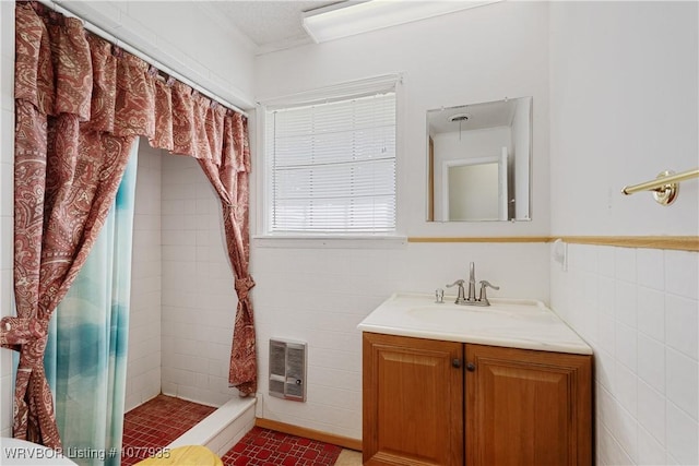 bathroom with curtained shower and vanity