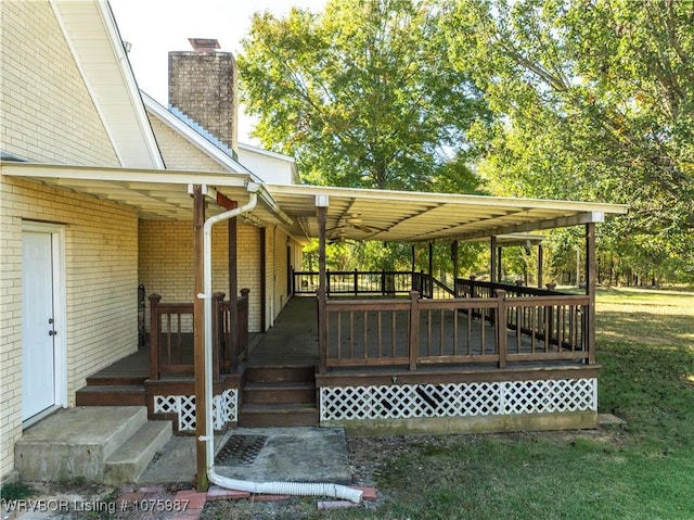 deck featuring a lawn and a porch