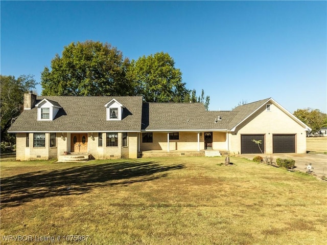 view of front facade featuring a front yard and a garage