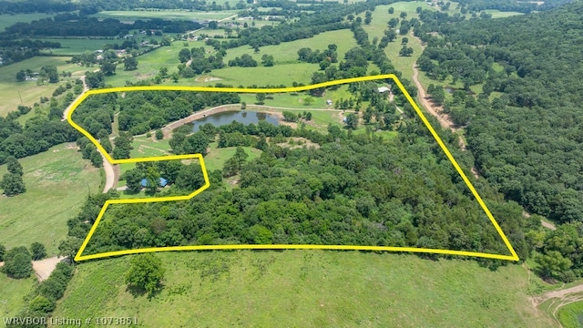 drone / aerial view featuring a rural view and a water view