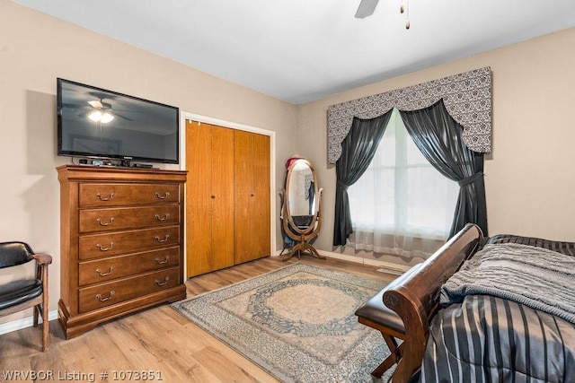 bedroom featuring wood-type flooring, a closet, and ceiling fan