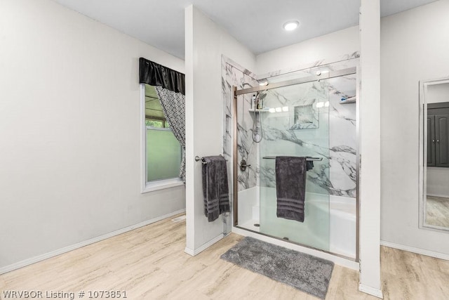 2055 Barber Rd, Booneville, AR 72927 - bathroom with wood finished floors and a marble finish shower