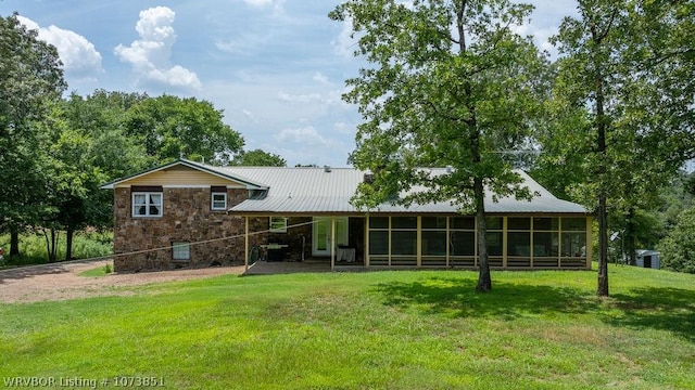 2055 Barber Rd, Booneville, AR 72927 - back of house featuring stone siding, a lawn, and a metal roof