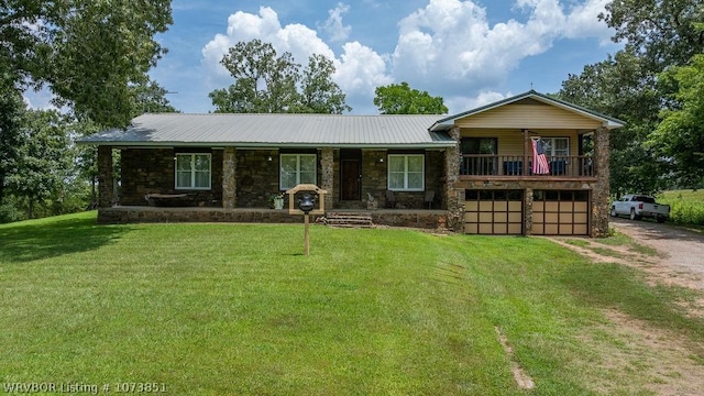 view of front of property with a front lawn and a garage