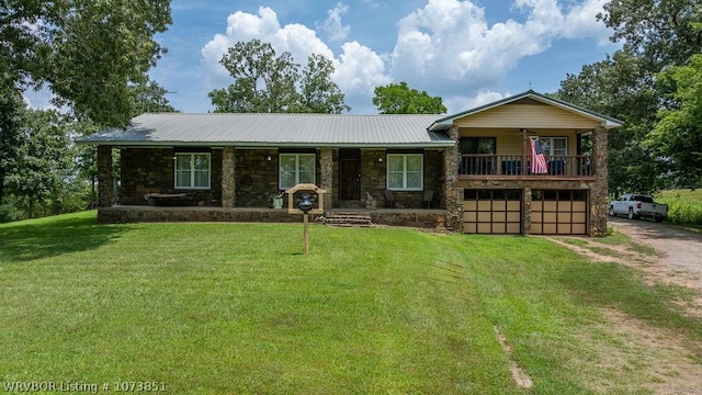 2055 Barber Rd, Booneville, AR 72927 - view of front of property with a porch, driveway, a front yard, an attached garage, and stone siding