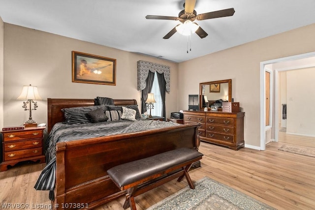 bedroom featuring light hardwood / wood-style flooring and ceiling fan