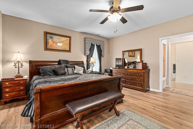 2055 Barber Rd, Booneville, AR 72927 - bedroom with light wood finished floors and a ceiling fan