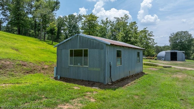 view of outdoor structure with a yard