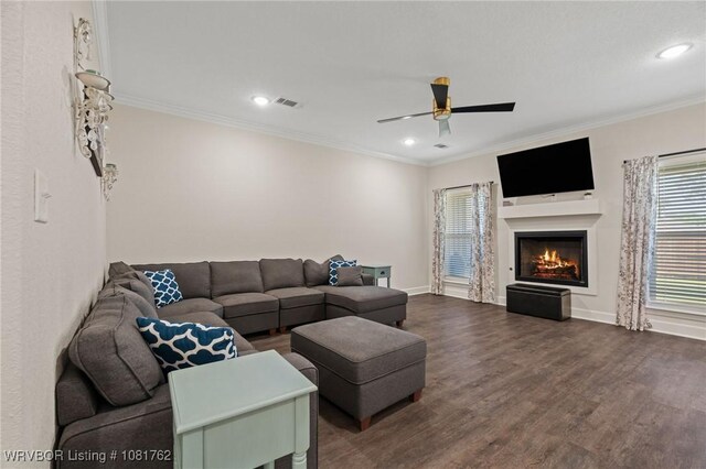 8323 Mclaren Dr, Fort Smith, AR 72916 - living area featuring a lit fireplace, dark wood-style flooring, ceiling fan, crown molding, and recessed lighting