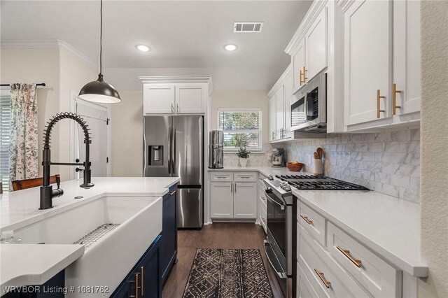 8323 Mclaren Dr, Fort Smith, AR 72916 - kitchen featuring stainless steel appliances, white cabinets, dark wood-style floors, tasteful backsplash, and light countertops