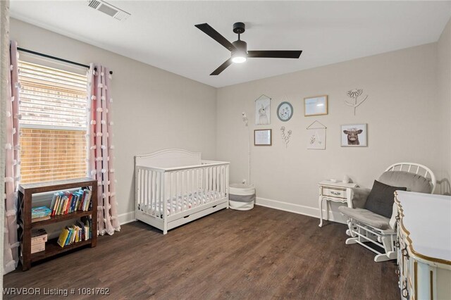 8323 Mclaren Dr, Fort Smith, AR 72916 - bedroom featuring wood finished floors, a nursery area, and ceiling fan