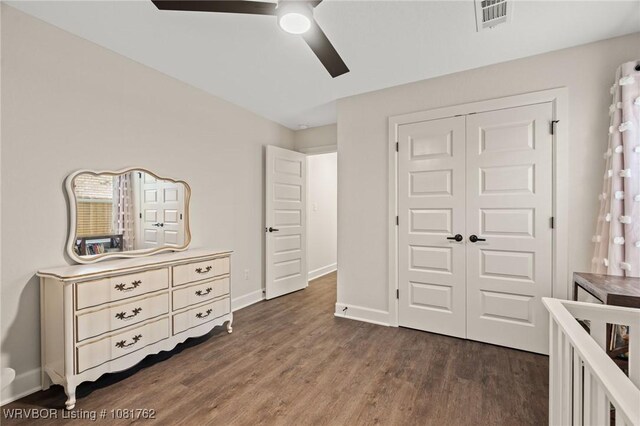 8323 Mclaren Dr, Fort Smith, AR 72916 - bedroom featuring dark wood-style floors, a closet, and ceiling fan