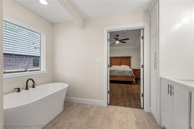 8323 Mclaren Dr, Fort Smith, AR 72916 - full bathroom with a soaking tub, connected bathroom, ceiling fan, and vanity