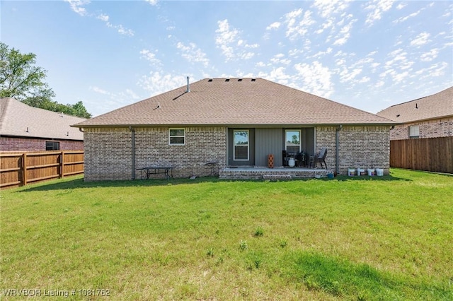 8323 Mclaren Dr, Fort Smith, AR 72916 - back of house featuring brick siding, a fenced backyard, and a patio