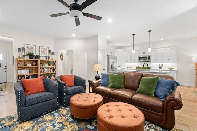 7907 Coltridge Way, Fort Smith, AR 72916 - living area featuring a ceiling fan, light wood-style floors, and crown molding