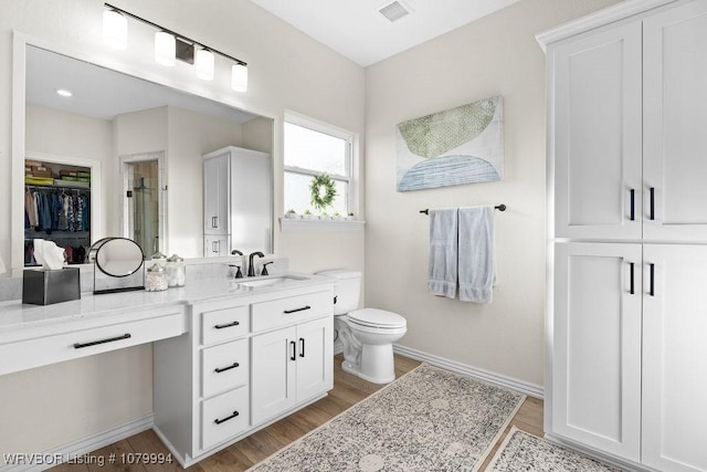 7907 Coltridge Way, Fort Smith, AR 72916 - full bathroom featuring wood finished floors, vanity, baseboards, and visible vents