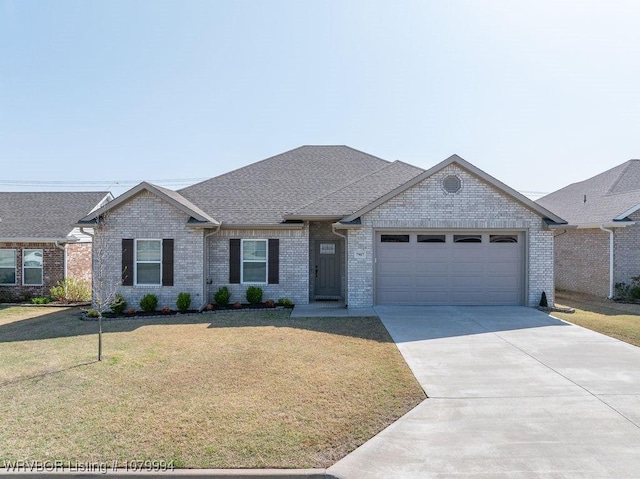 7907 Coltridge Way, Fort Smith, AR 72916 - view of front of property featuring concrete driveway, brick siding, a front lawn, a shingled roof, and a garage