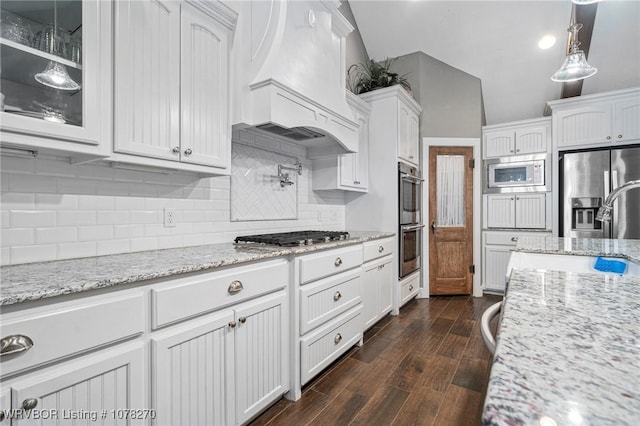 kitchen featuring premium range hood, white cabinetry, and stainless steel appliances