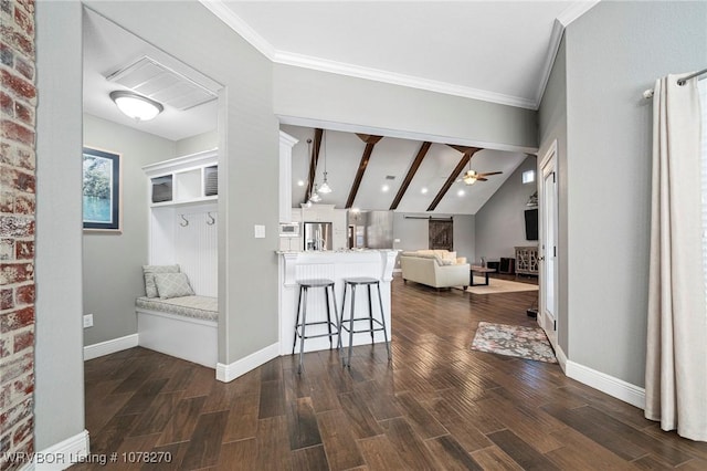 hall with lofted ceiling with beams