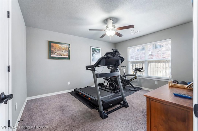 workout room featuring a textured ceiling, carpet floors, and ceiling fan