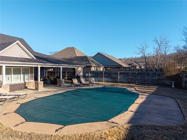 view of swimming pool with a patio