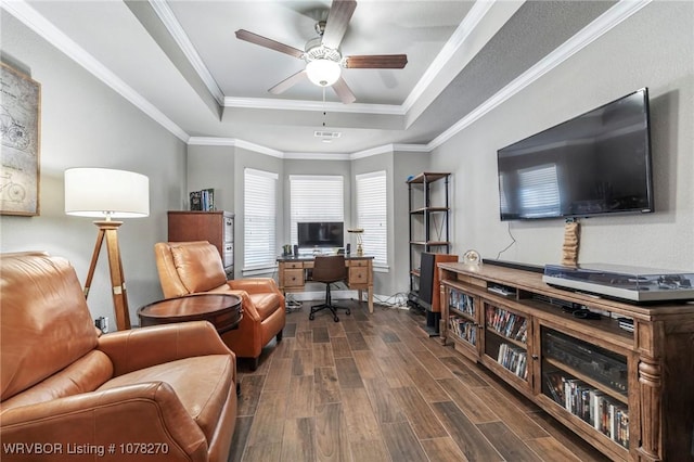 office area with ceiling fan, crown molding, and a tray ceiling