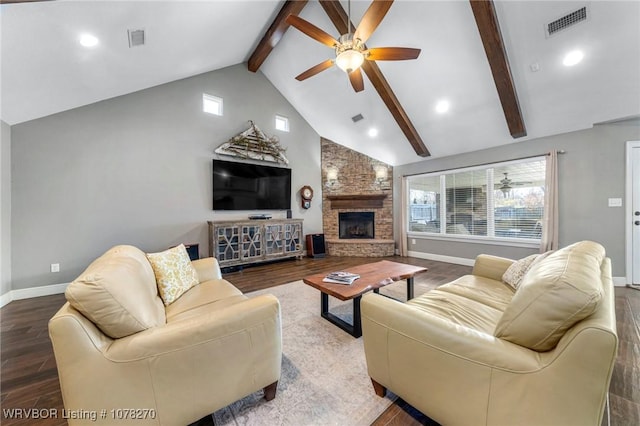 living room with ceiling fan, beam ceiling, hardwood / wood-style flooring, high vaulted ceiling, and a fireplace