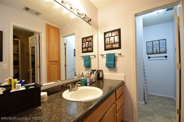 104527 S 4670th Rd, Sallisaw, OK 74955 - bathroom featuring vanity and a closet